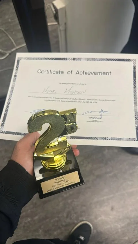 Holding the 2nd place trophy and the certificate of achievement from the AI Design Hackathon